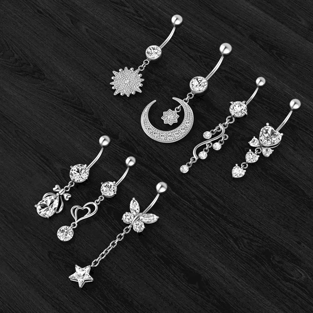 Belly Button Ring styles on display - moon, sunburst and vine dangles | Veloria