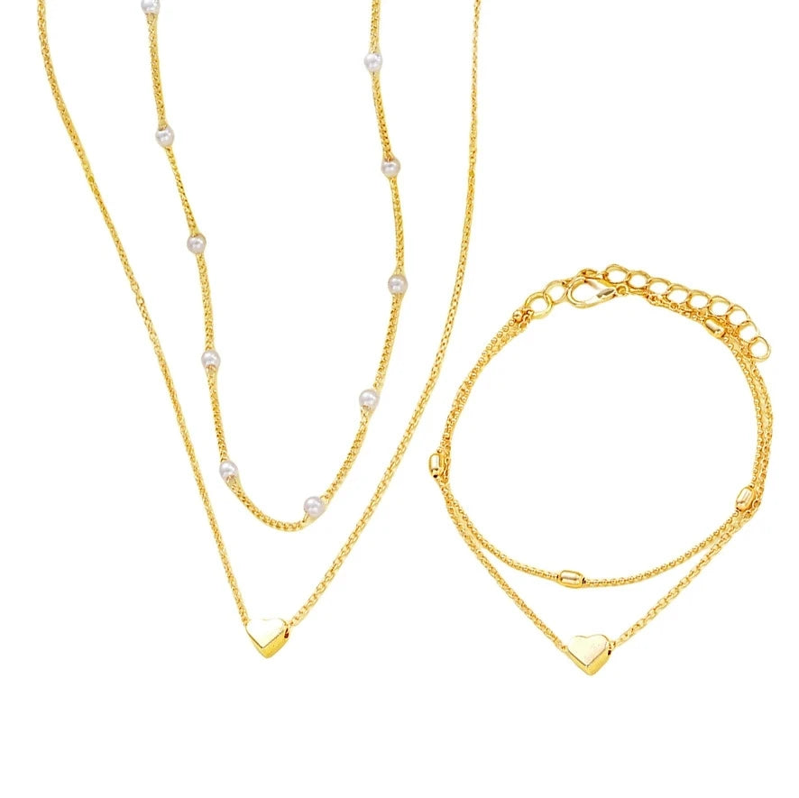 Pearl heart jewelry set necklace and bracelet for women - full outfit view | Veloria