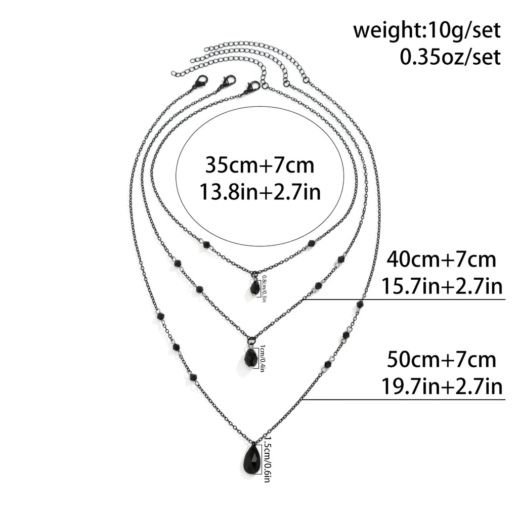 Layered Black Droplet Necklace - Triple Chain - close-up detail | Veloria