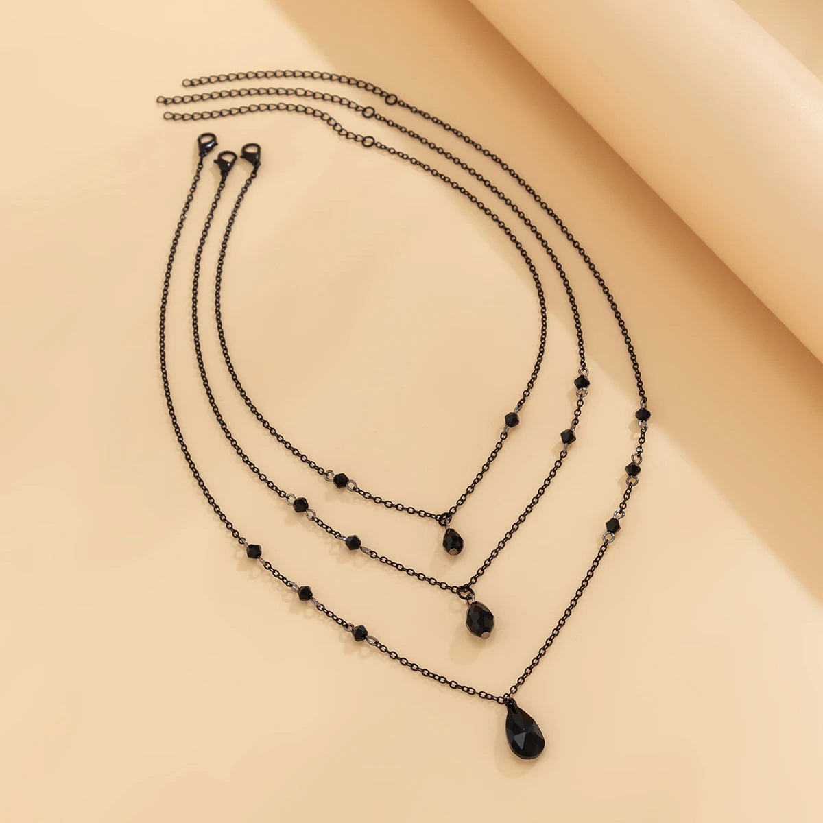 Layered Black Droplet Necklace - Triple Chain - product view | Veloria