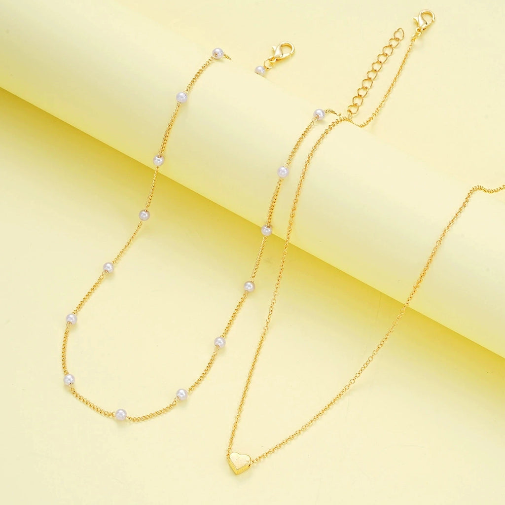 Pearl heart jewelry set necklace and bracelet for women - side view on model | Veloria