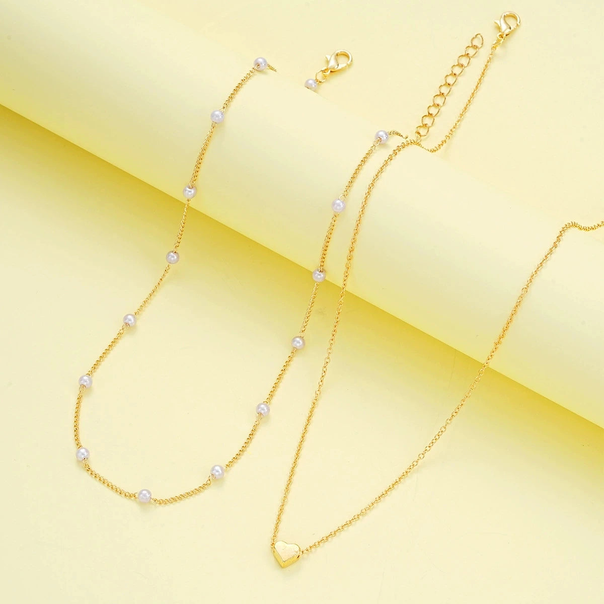 Pearl heart jewelry set necklace and bracelet for women - side view on model | Veloria