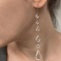 Dewdrop Tassel Earrings - light glow detail | Veloria