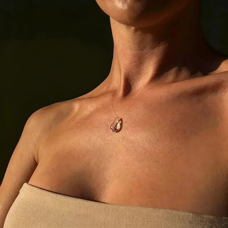 Clear Dewdrop Tassel Pendant Necklace - side view | Veloria