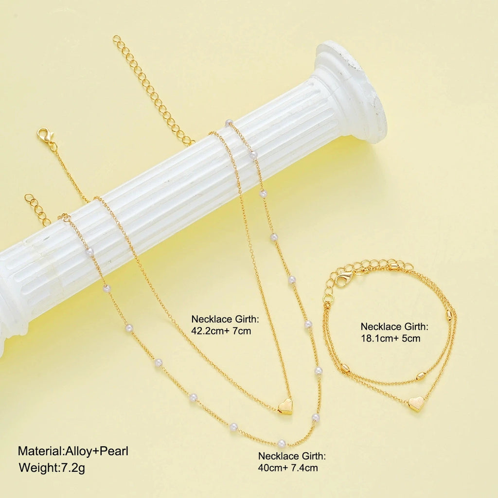 Pearl heart jewelry set necklace and bracelet for women - close-up detail | Veloria