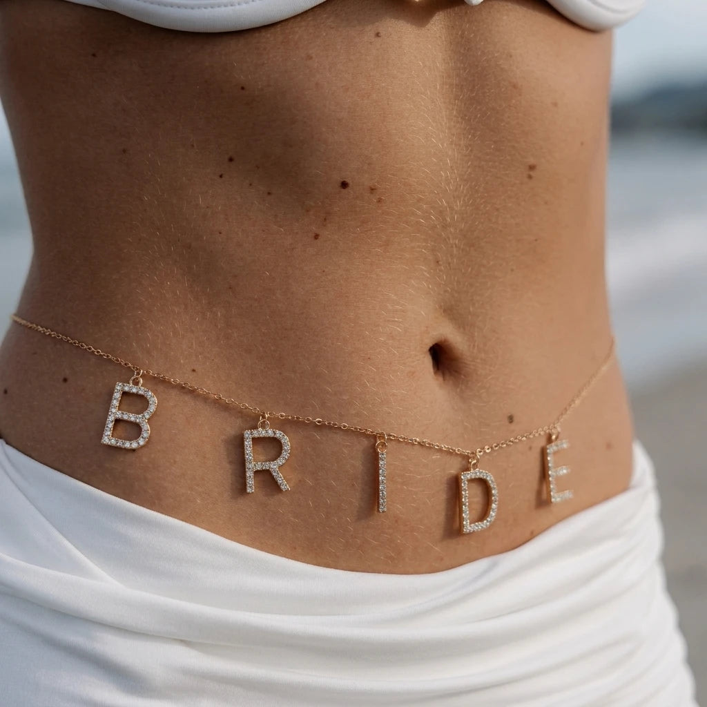 Crystal bridal waist chain wedding body jewelry for women - worn by a woman, front view | Veloria