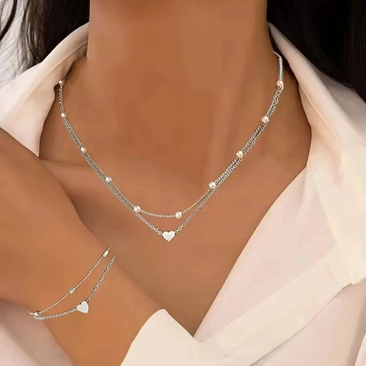 Pearl heart jewelry set necklace and bracelet for women - back view on model | Veloria