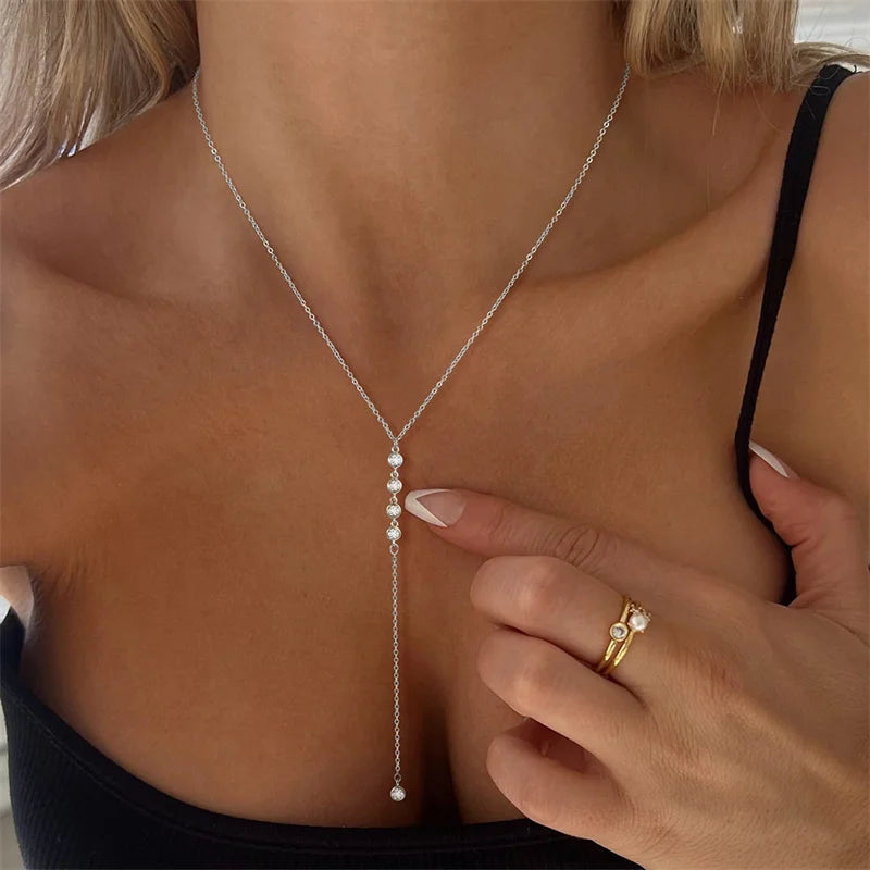 Boho metal body chain bikini jewelry for women - worn by a woman, front view | Veloria
