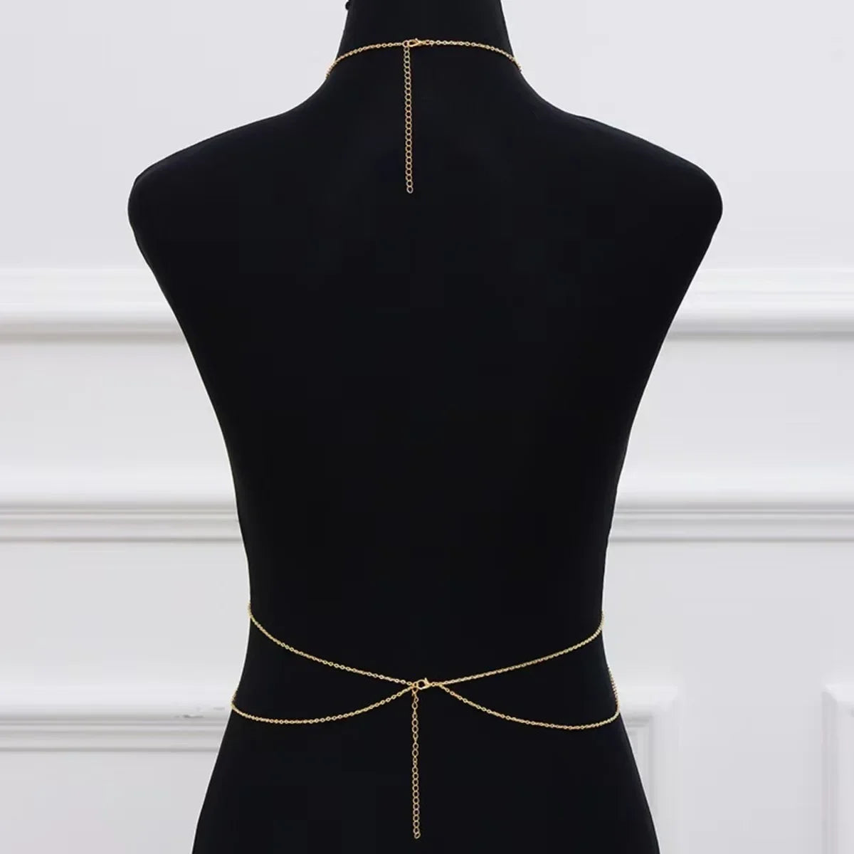 Minimalist cross body chain link jewelry for women - worn by a woman, front view | Veloria