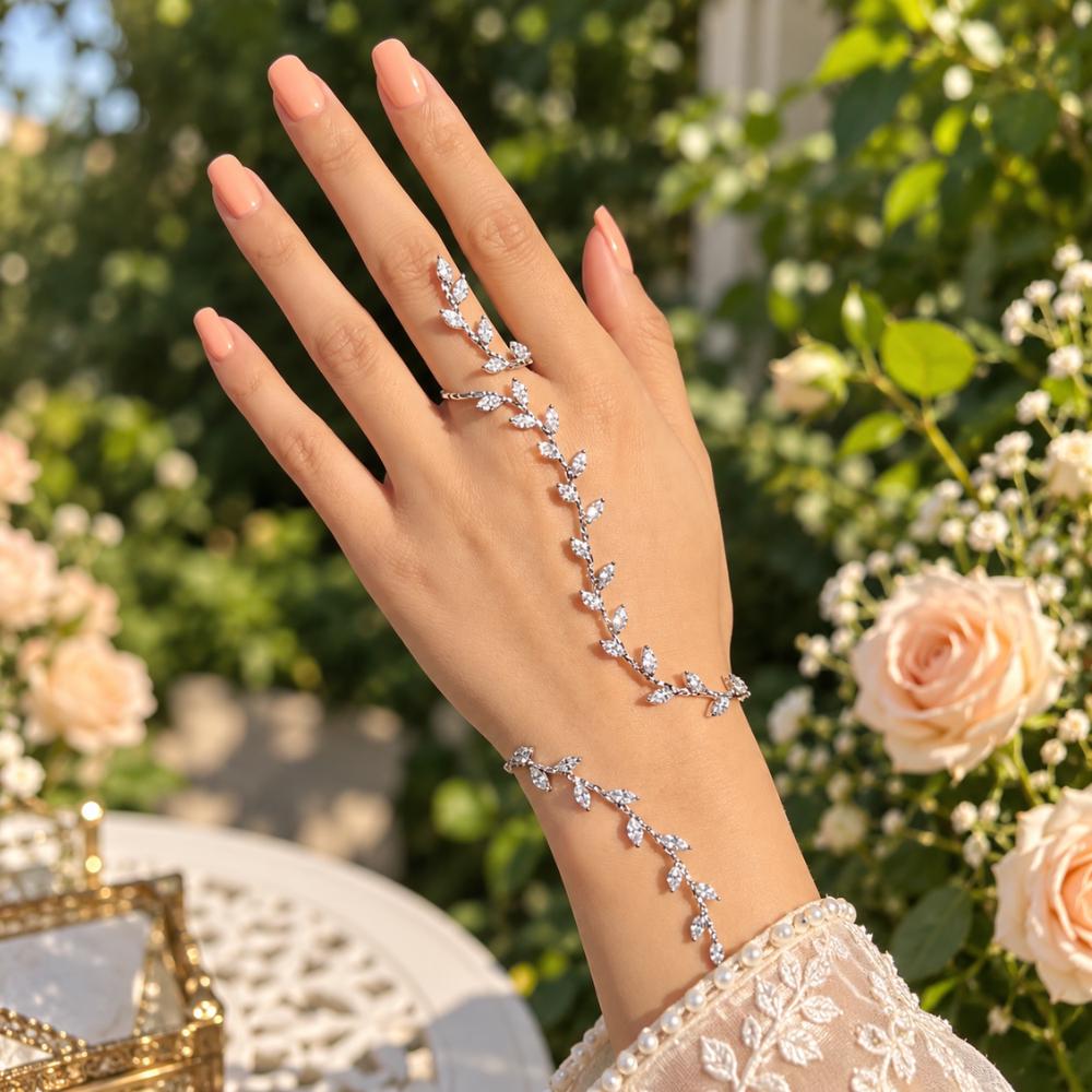 Hand chain bracelet shown on the hand with its ring connection