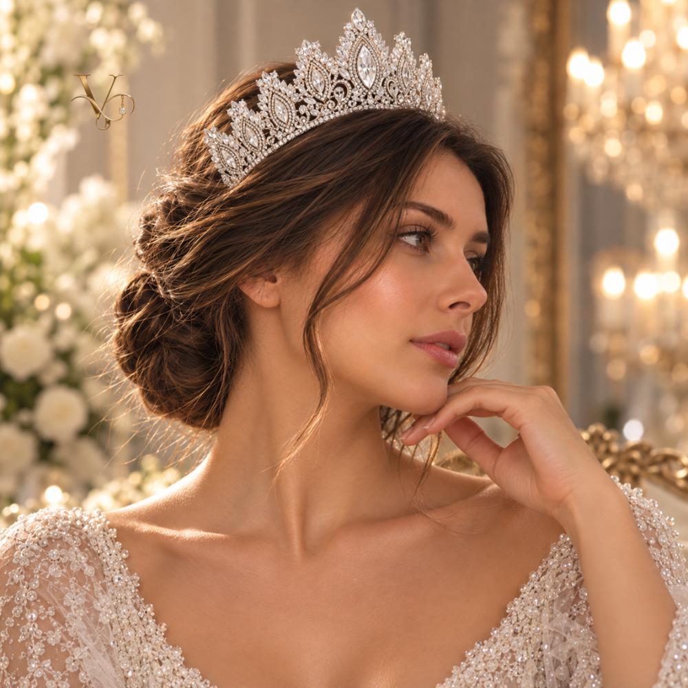 Silver crystal bridal crown worn by a bride with a veil