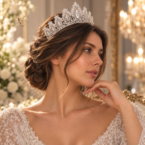 Silver crystal bridal crown worn by a bride with a veil