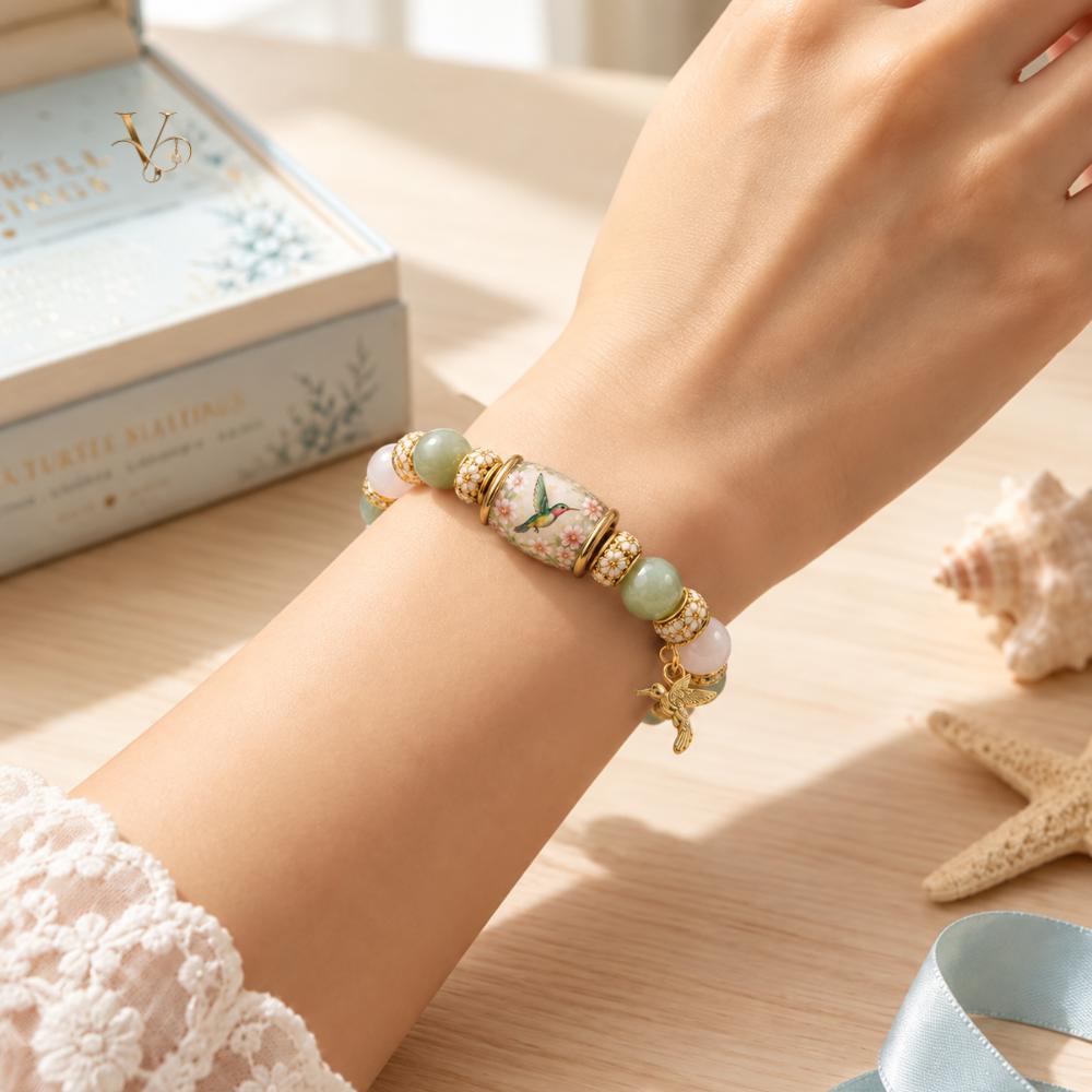 Handmade hummingbird bracelet - nature jewelry with a bird charm