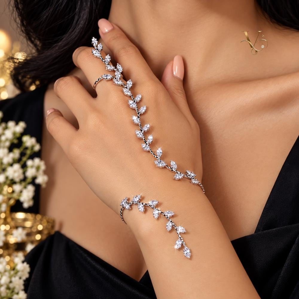 Silver hand chain bracelet with vine leaves, close-up detail