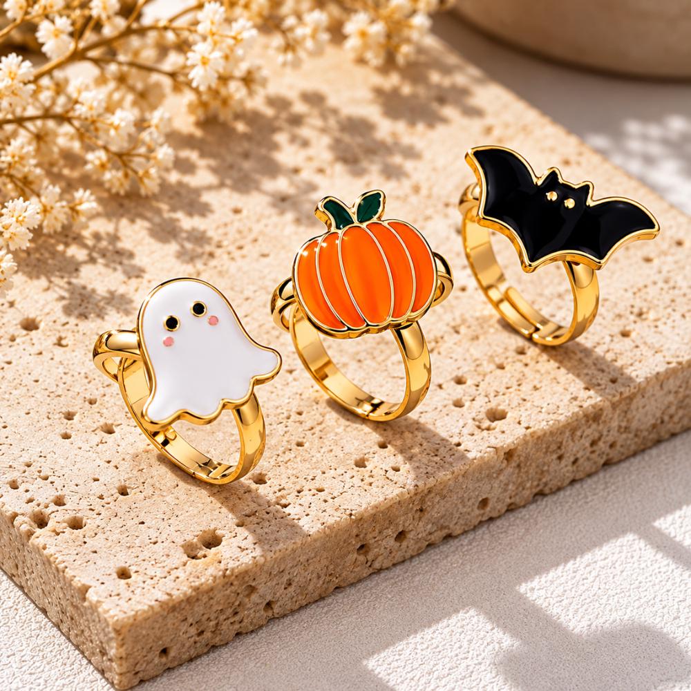 Sterling silver Halloween rings with spooky gothic details laid flat