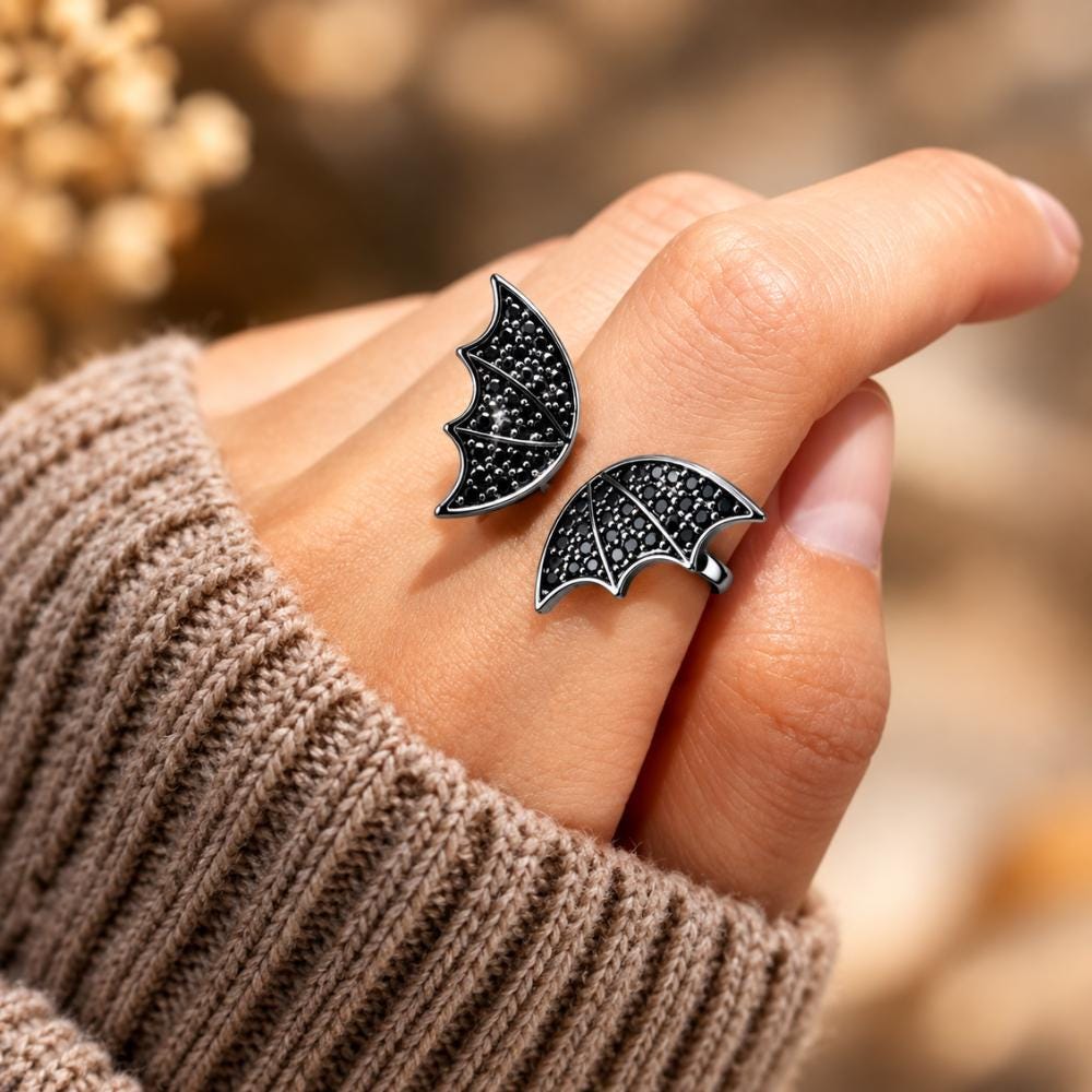 Gothic bat ring shown from the side with its winged silhouette