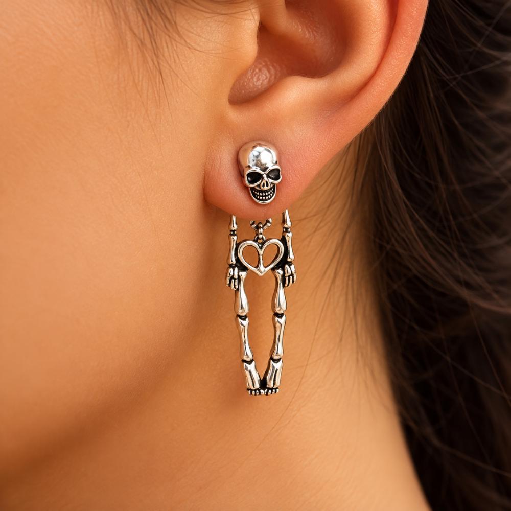 Skeleton skull earrings with moissanite accents worn for a Halloween look