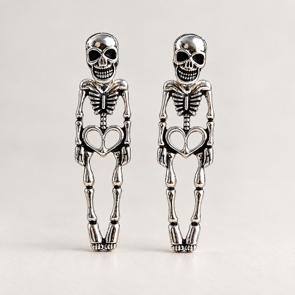 Halloween skull earrings shown from the side with skeleton detailing