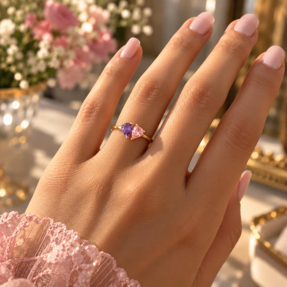 Mothers ring with two personalized birthstones worn on the finger
