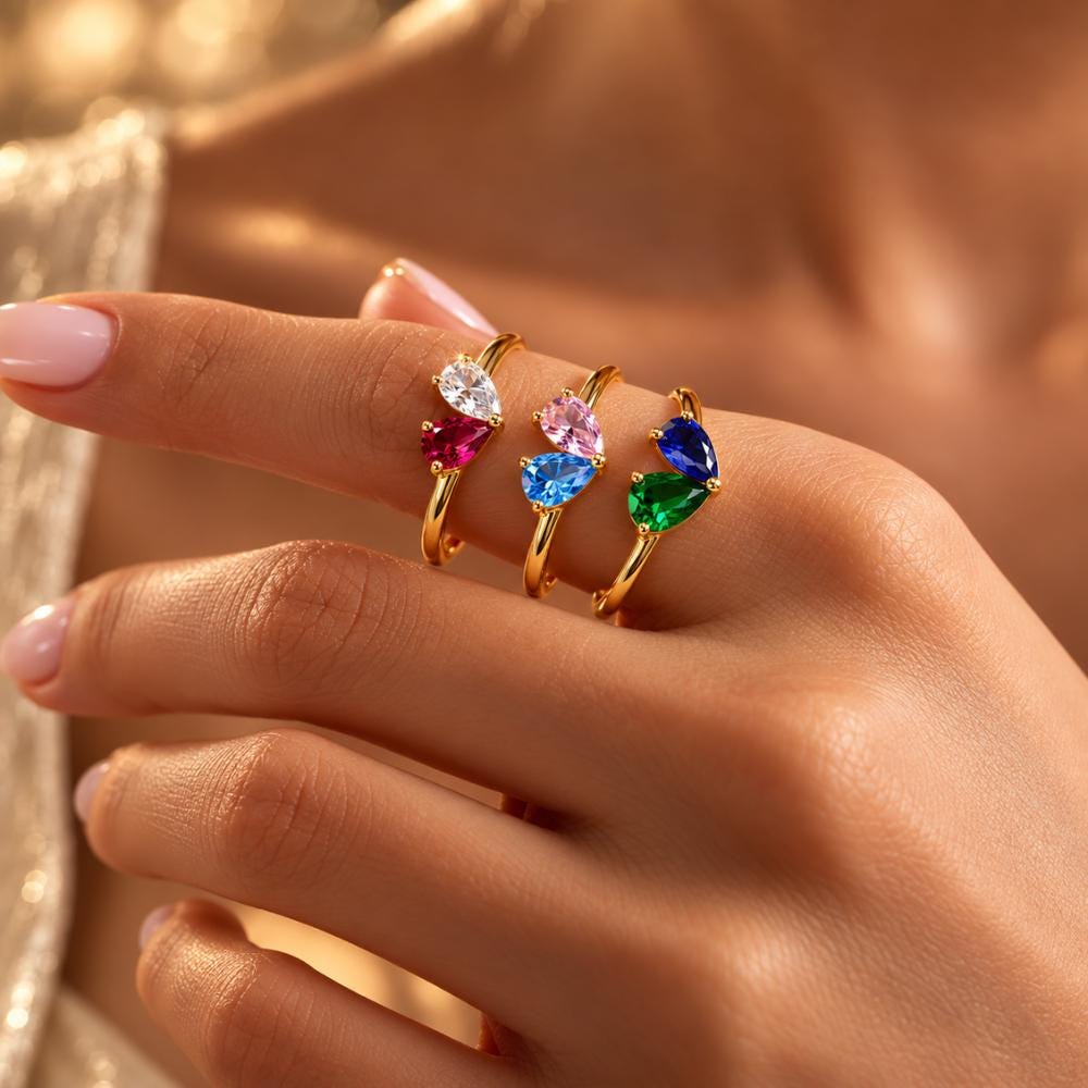 Two stone mothers ring shown from the side with its slim band