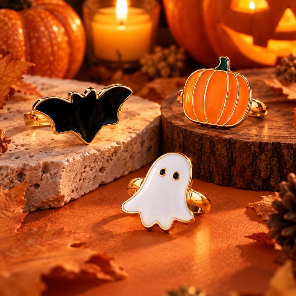 Three-piece Halloween ring set with ghost and pumpkin designs, close-up